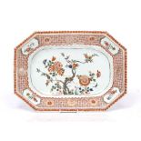 A Chinese porcelain export meat dish Qianlong having a central spray of flowers within a panelled