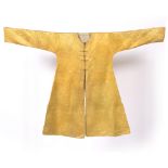 A Tibetan lama's robe circa 1800 yellow silk damask with roundels having five clawed dragons chasing