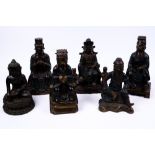 A Chinese bronze seated buddha in the 17th Century style 21cm high, two bronze Confucius figures,