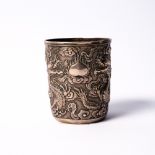 A Chinese white metal beaker late 19th Century embossed with dragons and clouds, maker I.C.,