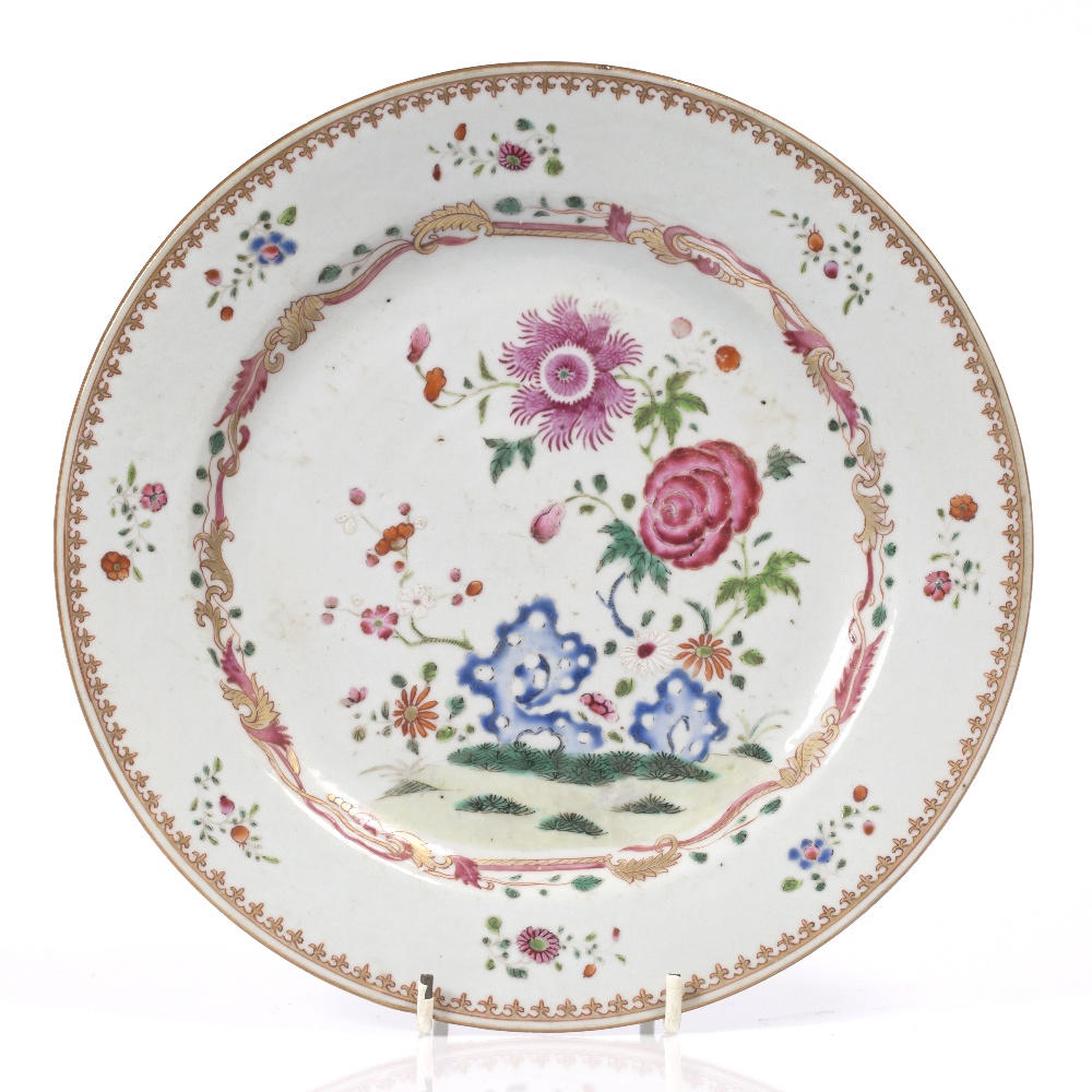 A Chinese famille rose plate Qianlong painted with polychrome enamels, 23.5cm