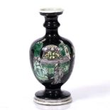 A Chinese miniature baluster vase late 19th Century decorated in green and yellow aubergine with