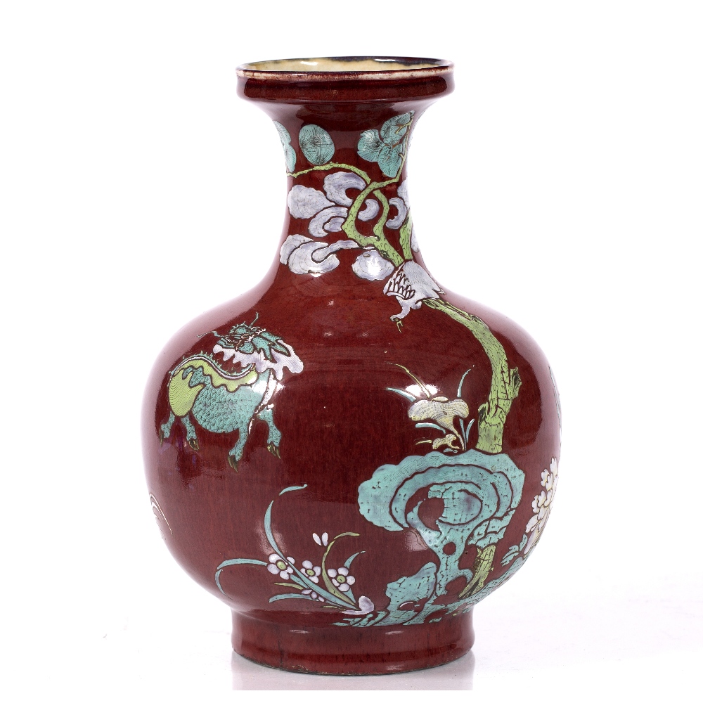 A Chinese porcelain vase Daoguang circa 1840 of sang-de-boeuf ground, with enamelling in yellow