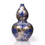 A Chinese blue and white vase 19th Century with silvered ground, having pomegranate and flower