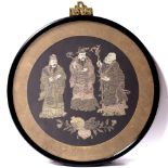 A pair of Chinese circular textile panels circa 1900 depicting musicians and immortals, 23cm