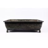 A Japanese Bronze Ikebana jardiniere Meiji period of two handled rectangular form, the sides