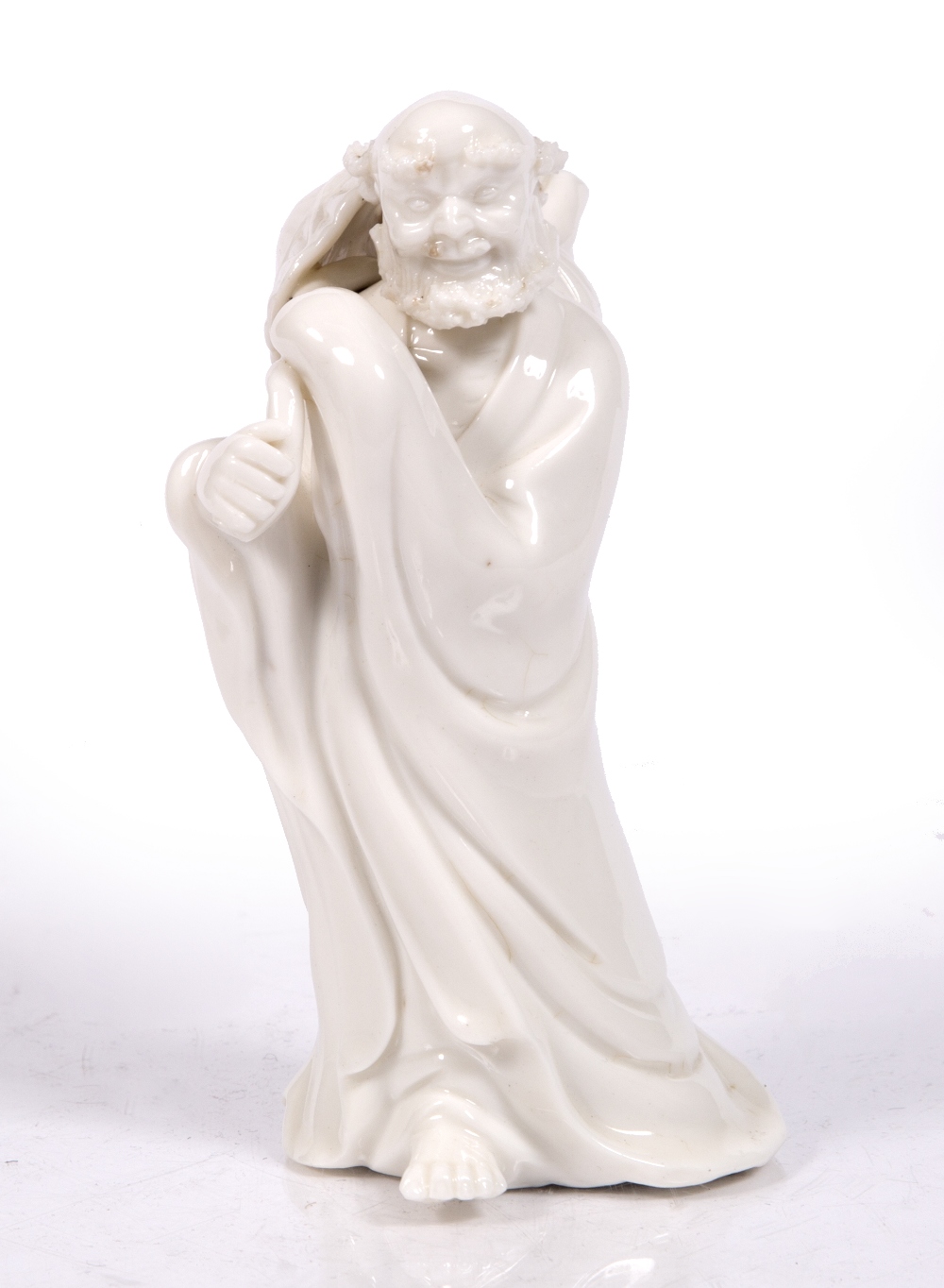 A Chinese Dehua figure of a Lohan 19th/20th Century 15cm high