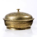 A Javanese large brass betel nut bowl and cover 19th Century engraved with panels of foliate and