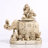 A Japanese ivory and shibayama style inlaid tusk box and cover Meiji period carved as an elephant