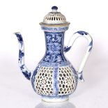 A Chinese blue and white porcelain ewer Ming period with reticulated panels, 27cm high