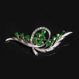 A jade and diamond spray brooch