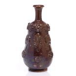 Canakkale pottery vase Turkish, 19th century of a brown ground,with applied floral roundels and