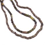 Two Islamic necklaces late 19th/early 20th Century colour glass link form 70cm and 66cm