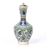 Qajar polychrome vase and cover 20th Century with trailing Iznik style decoration 35cm high