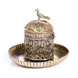 Mughal ink well Indian, 18th Century silver gilt, with a glass inset, foliate design with a bird