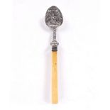 Indian white metal spoon late 19th Century the bowl decorated with Shiva having a bone handle 26cm