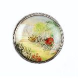 A NEEDLEPOINT PANEL BROOCH MOUNTED BY H G MURPHY FOR THE FALCON STUDIO, the circular needlepoint