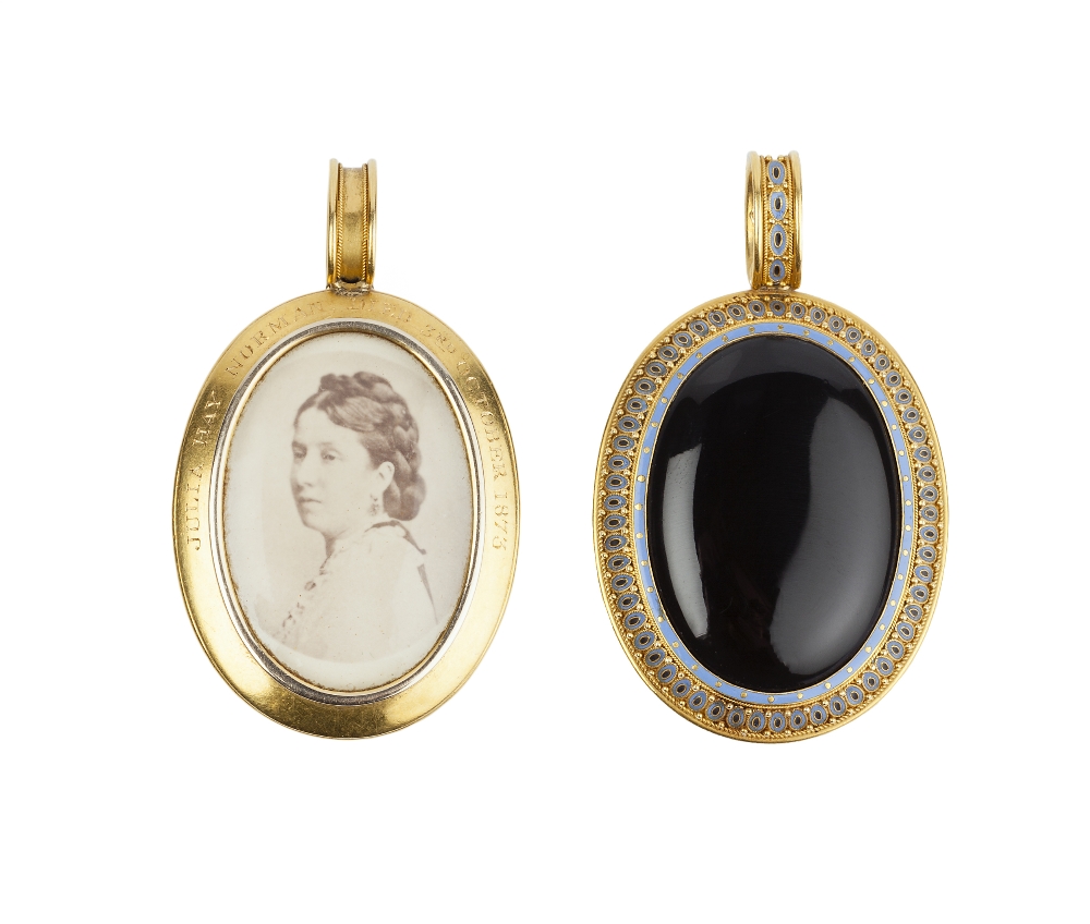 A VICTORIAN ONYX AND ENAMEL MEMORIAL LOCKET PENDANT BY PHILLIPS BROTHERS & SON, circa 1870, the oval