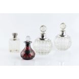 A PAIR OF SILVER MOUNTED CUT GLASS GLOBULAR SCENT BOTTLES, with faceted stoppers by Selfridge & Co