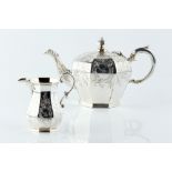 AN EARLY VICTORIAN SILVER TEAPOT AND MATCHING MILK JUG, of octagonally panelled form, engraved