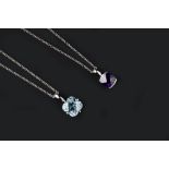 TWO GEM SET PENDANTS, comprising an amethyst single stone pendant, the cushion-shaped fancy-cut