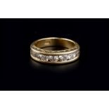 A DIAMOND HALF HOOP RING, the graduated round brilliant-cut diamonds in channel setting, to an