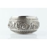 A 19TH CENTURY BURMESE WHITE METAL BOWL, decorated with a continuous scene of figures and animals in