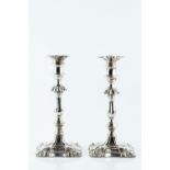 A PAIR OF MID 19TH CENTURY SILVER PLATED CANDLESTICKS, with knopped baluster columns, and shaped