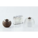 A GEORG JENSEN WHITE METAL TABLE LIGHTER, of Art Deco design, 8cm wide; and two silver mounted match