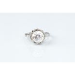 A DIAMOND SINGLE STONE RING, the transitional round brilliant-cut diamond in raised claw setting