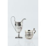 A GEORGE III SILVER CREAM JUG, with beaded border, foliate engraved decoration and square pedestal