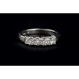 A DIAMOND FIVE STONE RING, the radiant-cut diamonds in claw setting, platinum mounted, total diamond