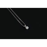 A DIAMOND SINGLE STONE PENDANT ON CHAIN, the round brilliant-cut diamond in four claw setting, below