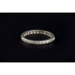 A DIAMOND FULL HOOP ETERNITY RING, set throughout with old and single-cut diamonds, white precious