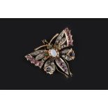 A VARI GEM-SET BUTTERFLY BROOCH, the openwork outstretched wings of lasque-cut diamonds edged with