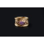 AN AMETHYST DRESS RING BY CLOGAU, the oval cabochon amethyst collet set to a tapered band, applied