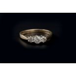 A DIAMOND THREE STONE RING, the graduated round brilliant-cut diamonds in claw setting, 9ct gold