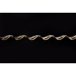 A 9CT GOLD FANCY-LINK NECKLACE, composed of repeating stylised ribbon panels, length 41cm