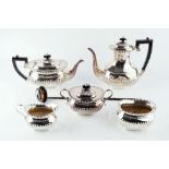 A SILVER PLATED FIVE PIECE TEA AND COFFEE SERVICE, of half lobed form, comprising teapot, coffee