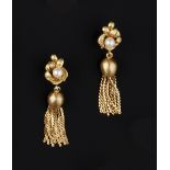 A PAIR OF CULTURED PEARL EAR PENDANTS, each tassel drop surmounted by a textured foliate panel