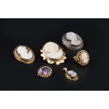 A COLLECTION OF CAMEO JEWELLERY, comprising two oval shell cameo brooches, each carved to depict a