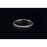 A DIAMOND HALF HOOP RING, inset with a line of round brilliant-cut diamonds, platinum mounted, total