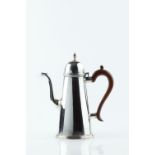 A SILVER COFFEE POT, of plain tapering form, with domed hinged cover and wooden handle, maker's