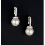 A PAIR OF CULTURED PEARL AND DIAMOND EARRINGS, each cultured pearl drop surmounted by two rows of