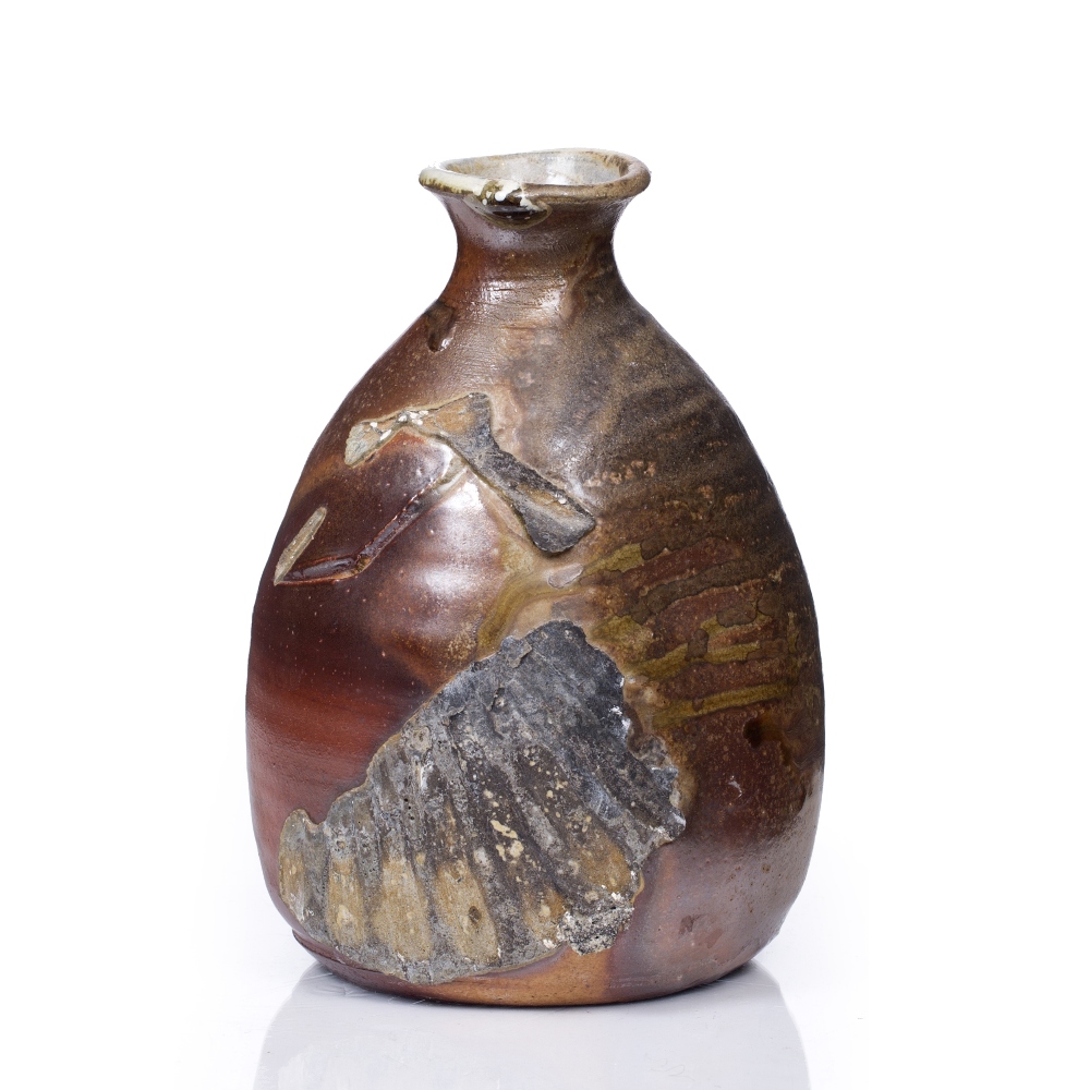 Nic Collins (20th Century) Vase applied fossil decoration signed 17.5cm high.