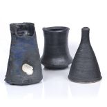 Dan Kelly (Contemporary) Three vessels matt black glazes 19.5cm, 16cm and 18cm high (3).