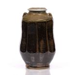 Mike Dodd (b.1943) Vase tenmoku/rust glaze, faceted sides impressed potter's seal 31.5cm high.