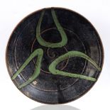 John Jelfs (b.1946) Bowl tenmoku, with poured green glaze impressed potter's seal 25.5cm diameter.