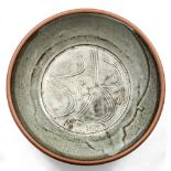 Phil Rogers (b.1951) Charger ash glaze, combed decoration impressed potter's seal 49cm diameter.