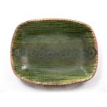 David Leach (1911-2015) Dish slipware, green glaze impressed potter's seal 42cm diameter.